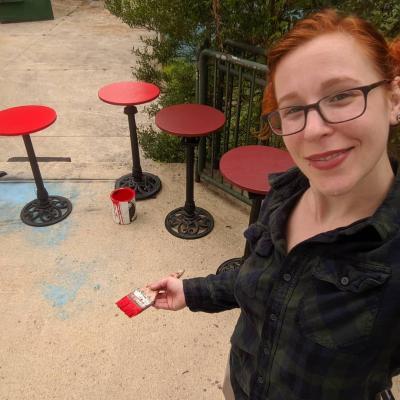 Painting the tables red for the set of Cabaret 